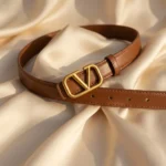 Women's tan brown leather belt with antique gold V logo buckle (1)