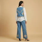 Women's two piece ensemble featuring a sheer white embroidered shirt and a blue denim style vest with golden floral motifs and crochet borders (4)