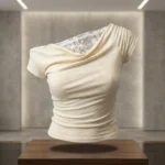 a cream colored asymmetrical off shoulder top with white lace detailing (1)