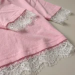 a pink crew neck top with white lace sleeves and V shaped white lace back panel (5)