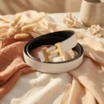a white textured leather belt with a gold H shaped buckle (4)