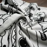 women's white oversized t shirt featuring a colorful animated character print and iridescent rhinestone detailing (2)