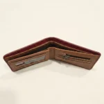 Brown bifold men's wallet featuring a 3D embossed crocodile design (1)