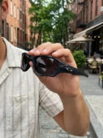 Oakley men's matte black rectangular sports sunglasses with dark grey lenses on a leather case (4)