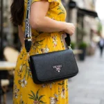 Prada Black Pebbled Leather Crossbody Bag with White Logo Webbing Strap (1)