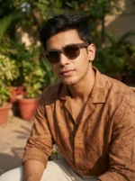 Ray Ban men's matte brown wayfarer sunglasses with brown polarized lenses shown from side and front angles (3)