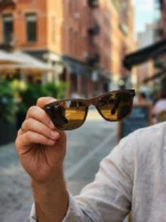 Ray Ban men's matte brown wayfarer sunglasses with brown polarized lenses shown from side and front angles (5)