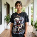 Woman wearing a black oversized t shirt with a vintage country star graphic print (1)