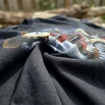 Woman wearing a black oversized t shirt with a vintage country star graphic print (4)