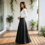Woman wearing a high waisted solid black pleated maxi skirt (1)
