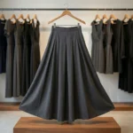 Woman wearing a high waisted solid black pleated maxi skirt (4)