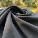 Woman wearing a high waisted solid black pleated maxi skirt (5)