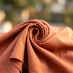 Woman wearing a rust matching co ord set with slip dress and overshirt (5)