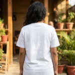 Woman wearing a white oversized t shirt with a cartoon patchwork design (1)