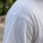 Woman wearing a white oversized t shirt with a cartoon patchwork design (3)