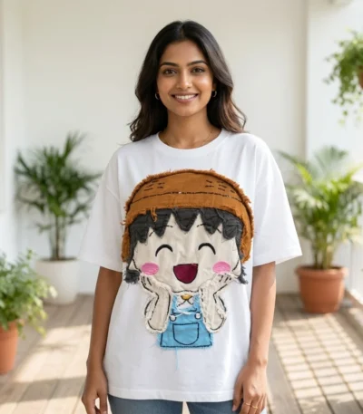 Woman wearing a white oversized t shirt with a cartoon patchwork design (4)