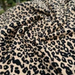 Woman wearing beige oversized leopard print t shirt with graphic patch (1)