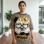 Woman wearing beige oversized leopard print t shirt with graphic patch (2)