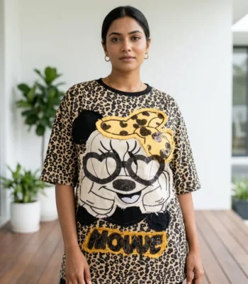 Woman wearing beige oversized leopard print t shirt with graphic patch (2)