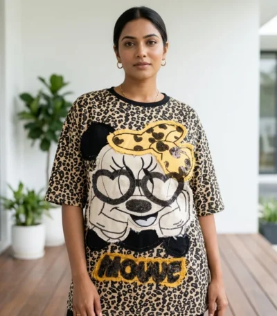 Woman wearing beige oversized leopard print t shirt with graphic patch (2)