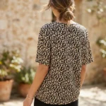 Woman wearing beige oversized leopard print t shirt with graphic patch (3)