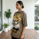 Woman wearing beige oversized leopard print t shirt with graphic patch (4)