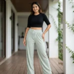 Woman wearing mint green pleated wide leg pants with slight sparkle (1)