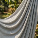 Woman wearing mint green pleated wide leg pants with slight sparkle (2)