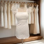 white textured mini dress with sheer yoke and ruffled cap sleeves, featuring a back bow detail (3)