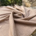 woman in a relaxed beige ribbed matching top and wide leg trousers (5)