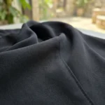 woman wearing a classic solid black long sleeve collared shirt (5)