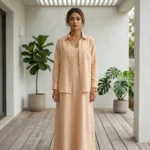 woman wearing a light beige two piece maxi slip dress with a matching open long sleeve shirt (3)