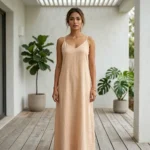 woman wearing a light beige two piece maxi slip dress with a matching open long sleeve shirt (5)