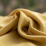 woman wearing a mustard yellow tie neck formal blouse with white and yellow polka dots (3)