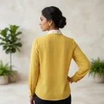 woman wearing a mustard yellow tie neck formal blouse with white and yellow polka dots (5)