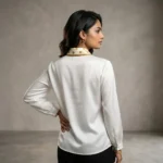woman wearing an ivory formal blouse with a beige polka dot neck tie and pearl ring (3)