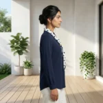 woman wearing an ivory formal blouse with a beige polka dot neck tie and pearl ring (4)