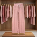 woman wearing dusty pink ribbed straight pants with sparkle details and a white drawstring (2)