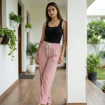 woman wearing dusty pink ribbed straight pants with sparkle details and a white drawstring (3)