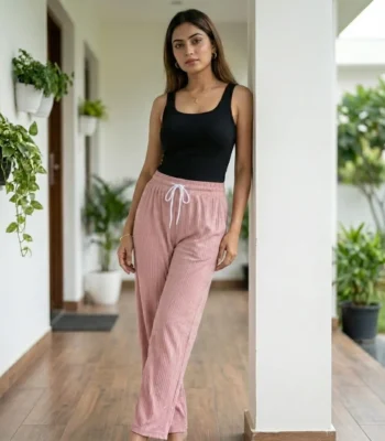 woman wearing dusty pink ribbed straight pants with sparkle details and a white drawstring (3)