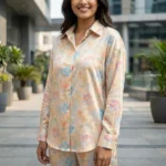 Indian woman wearing a pastel floral printed co ord set with tucked in full sleeve shirt and wide leg trouser (4)