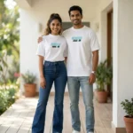 Man and woman wearing matching white Scooter Mode On graphic t shirts (1)