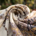 Woman wearing beige off shoulder paisley maxi dress with tie belt (3)