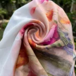 a white half sleeve button down shirt with a pink and orange watercolor floral print (3)