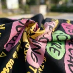 black oversized t shirt with a pink textured graphic print (3)