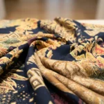 man wearing a navy blue half sleeve shirt with gold and maroon floral prints (4)