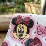 white women's oversized t shirt with a pink Minnie Mouse graphic print (4)