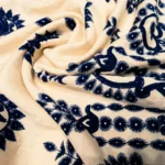 woman wearing a beige and navy blue ethnic print shirt and trouser co ord set (2)