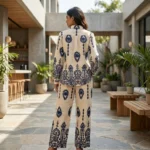 woman wearing a beige and navy blue ethnic print shirt and trouser co ord set (3)