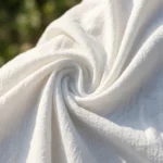 woman wearing a white crinkled cotton long sleeve shirt (1)